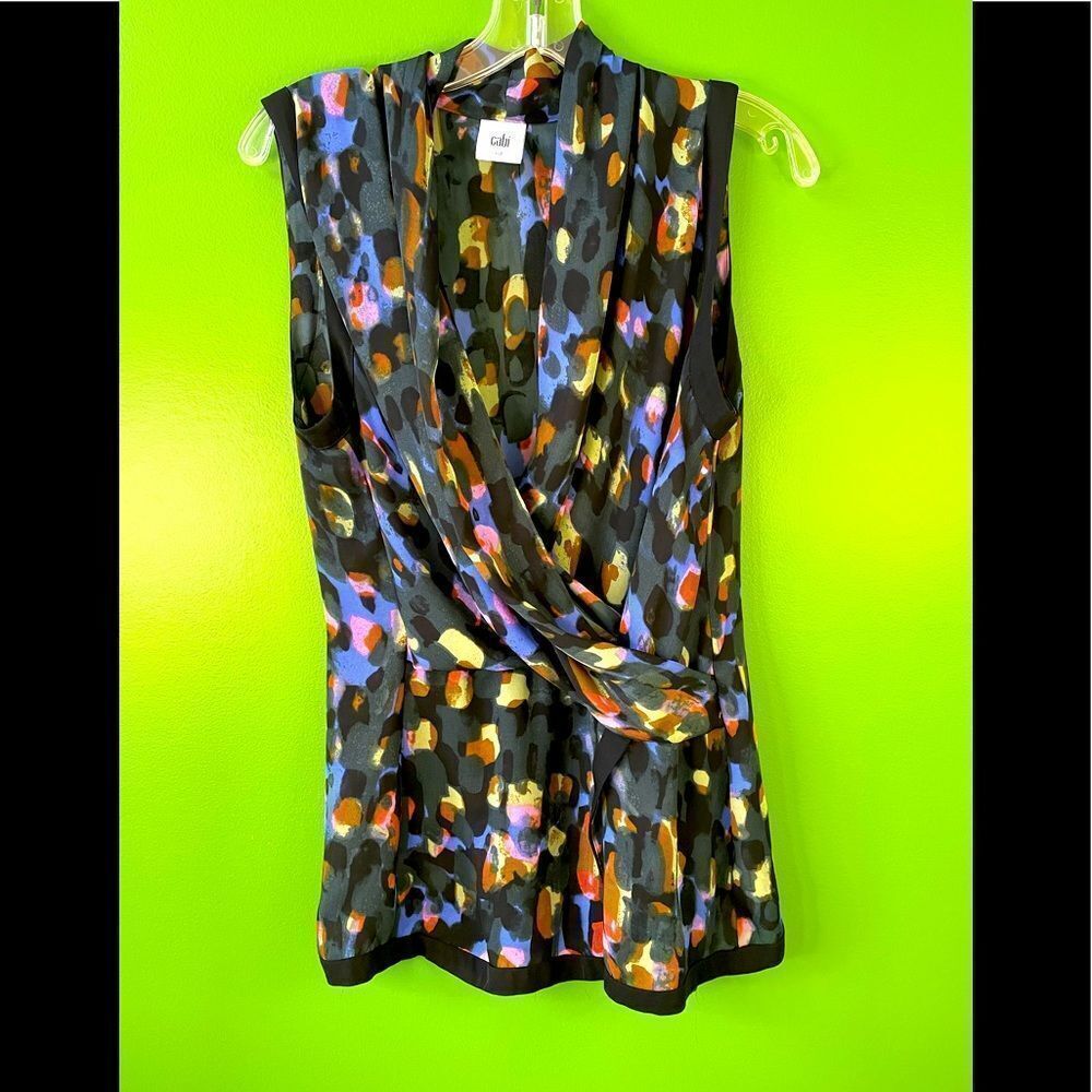 CABI front drape, sleeveless blouse in black with multi-color pattern